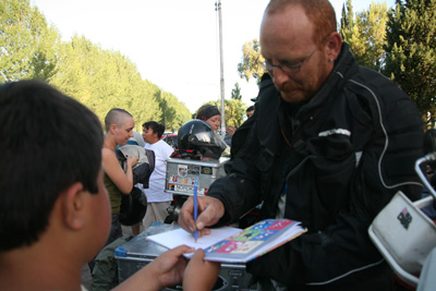 084 Javier from Dakar Motos signing autographs.jpg